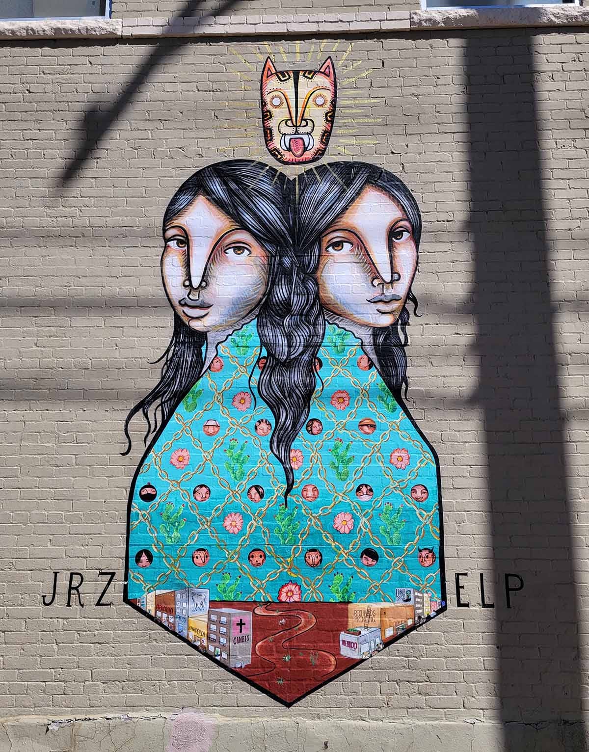Twin girls in a mural representing the twin cities of El Paso and Juarez.