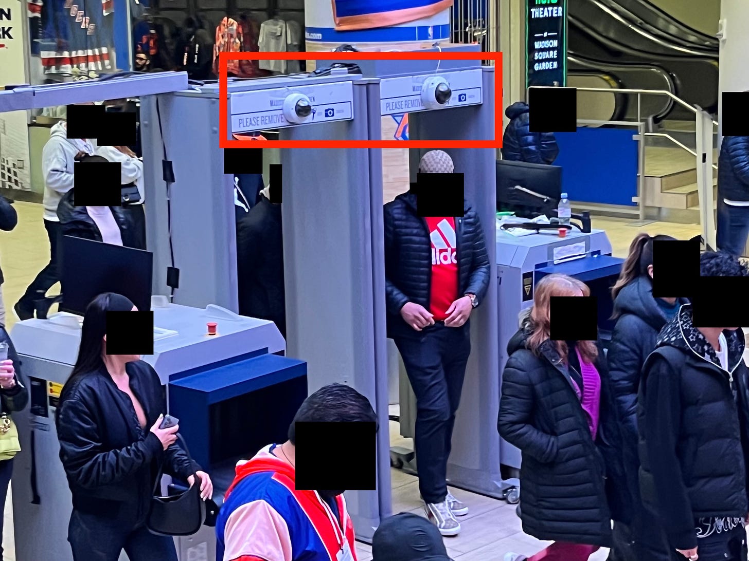 A photo of a security checkpoint at Madison Square Garden with a red box around facial recognition enabled cameras.