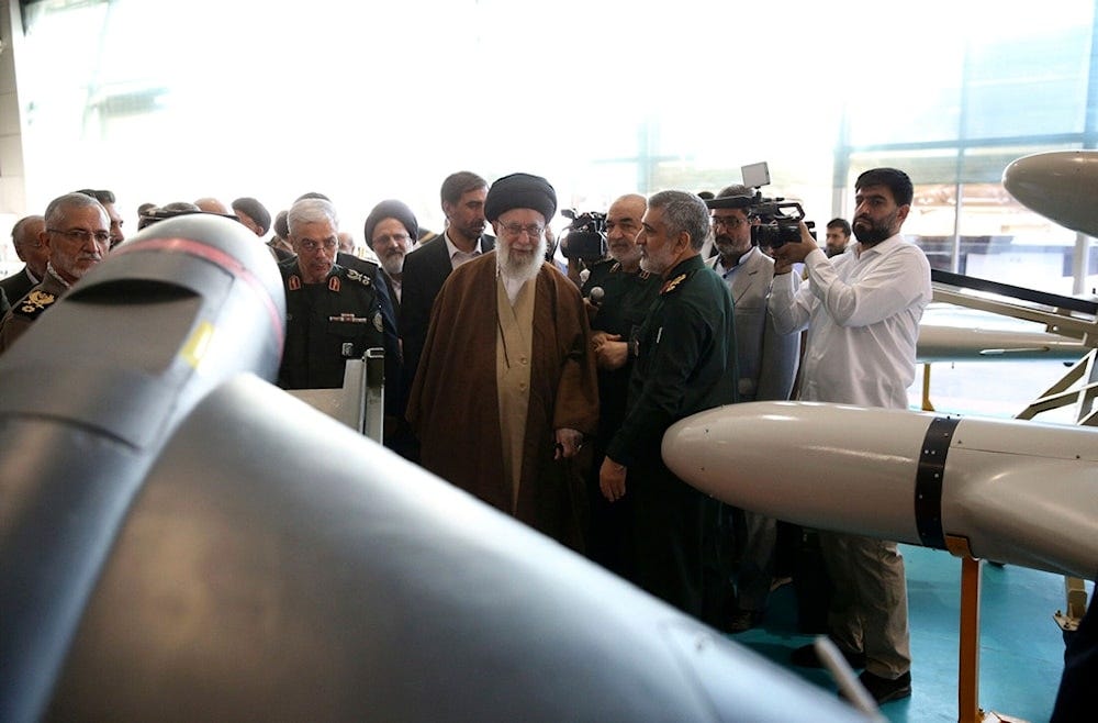 Iranian Leader Ayatollah Ali Khamenei, center, visits an exhibition of the Revolutionary Guard's aerospace achievements as he is accompanied by the armed forces commanders, in Iran, Sunday, November 19, 2023 (AP)