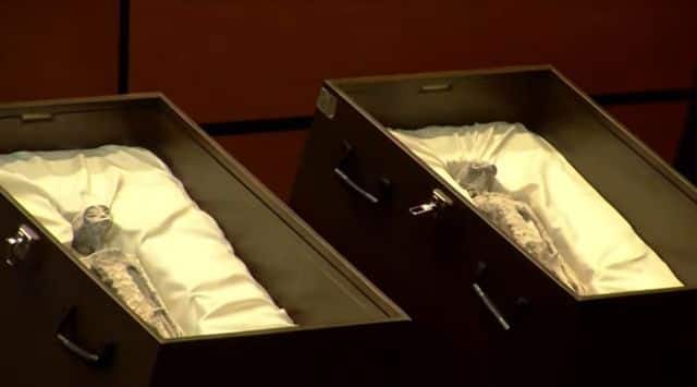 Two coffins holding what people claim are alien bodies