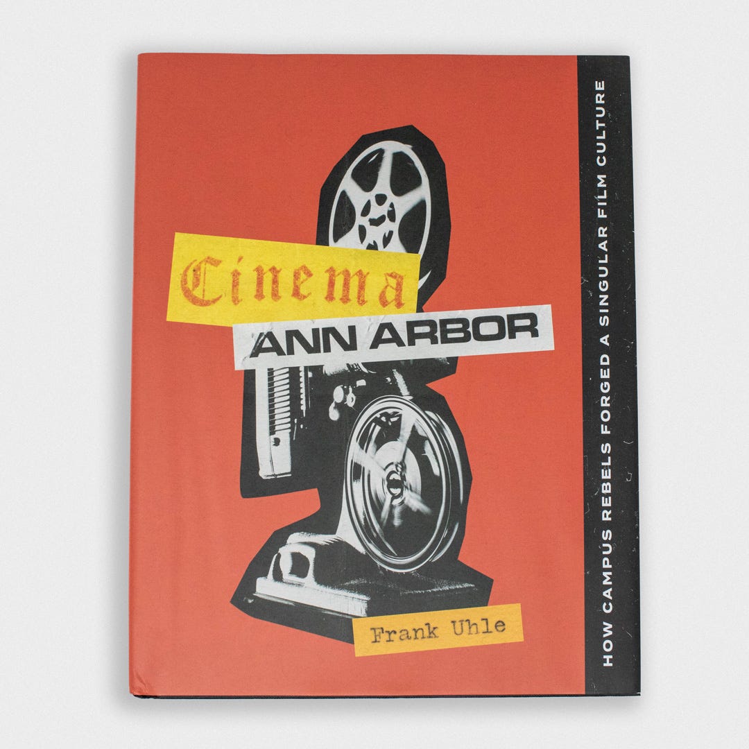 A red book cover with a black and white film projector collaged with ephemera spelling out "Cinema Ann Arbor."