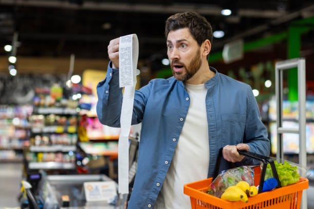 80+ Surprised Man Looking At Store Receipt Stock Photos, Pictures &  Royalty-Free Images - iStock
