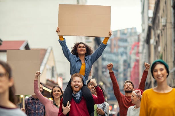 Happy Group Of People Holding Blank Banner During Strike Stock Photo -  Download Image Now - iStock