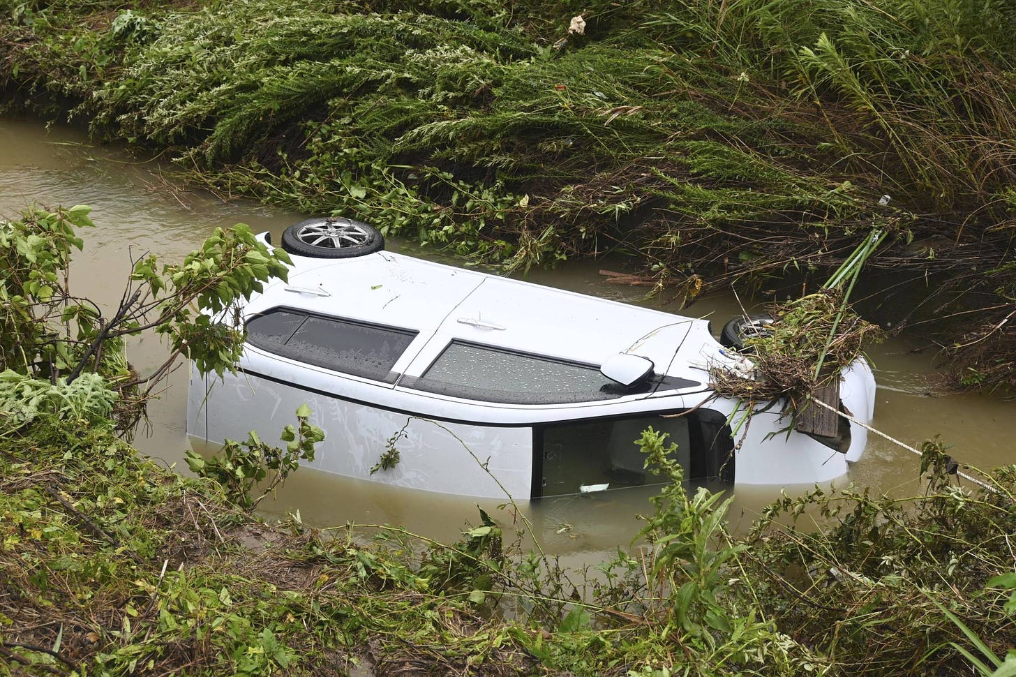 A car that was washed away in Yamaguchi Prefeture on Saturday