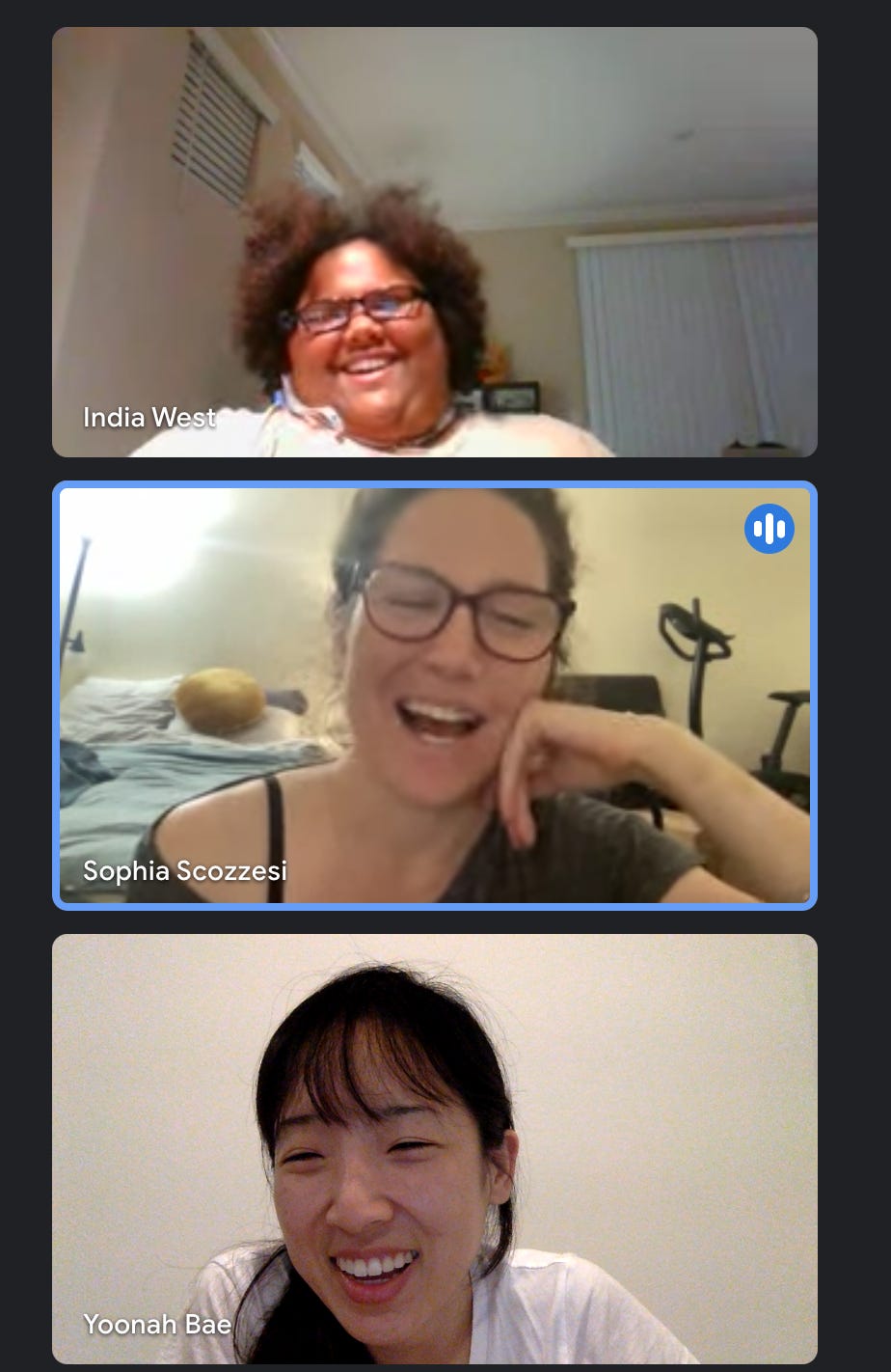 Three ladies on a virtual meeting smiling. Watching India demonstrating her assistive tech called OrCam.