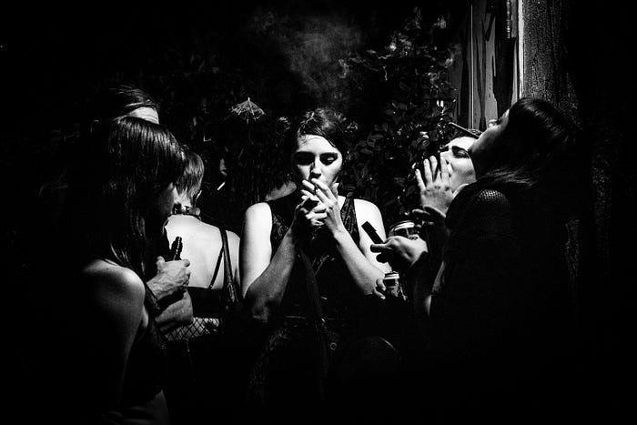 Goths all looking the same and smoking