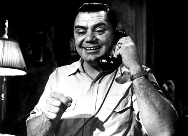 Screenshot from the film Marty showing the title character on the phone.