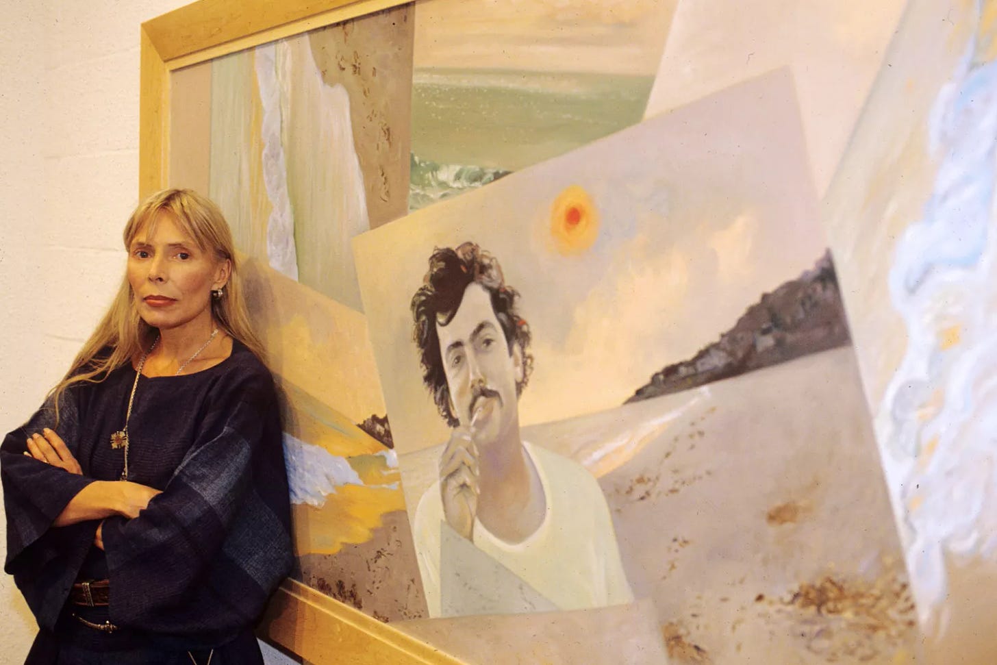 Joni Mitchell and her painting 'Malibu Fire', featuring husband Larry Klein
