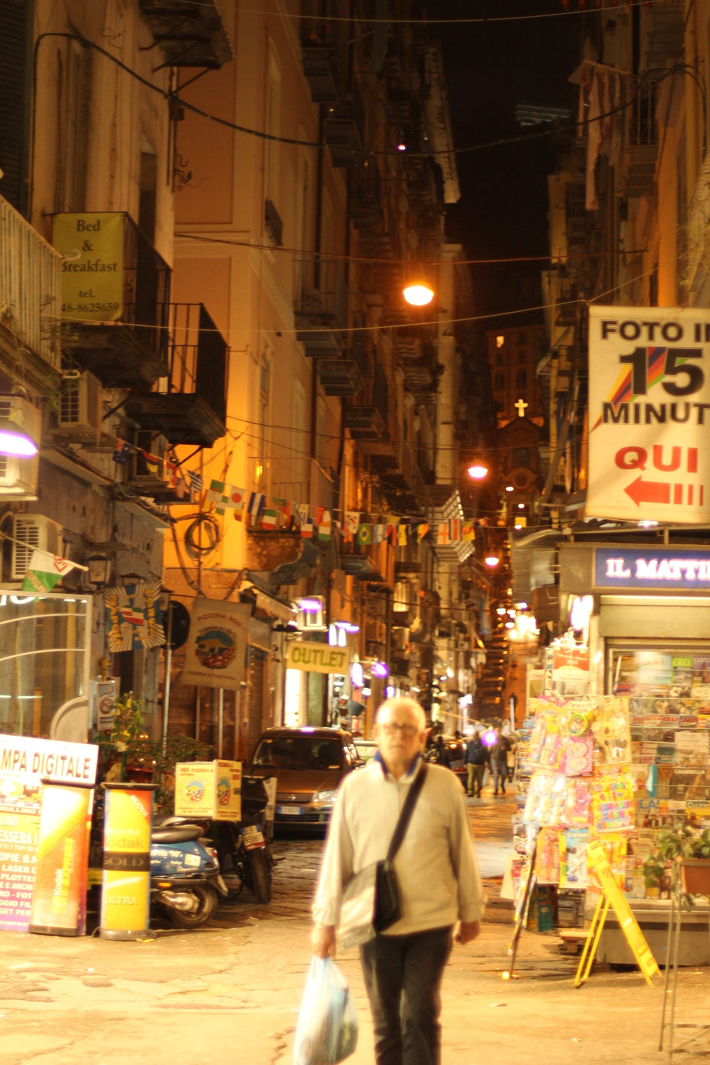 A nighttime street scene in Naples