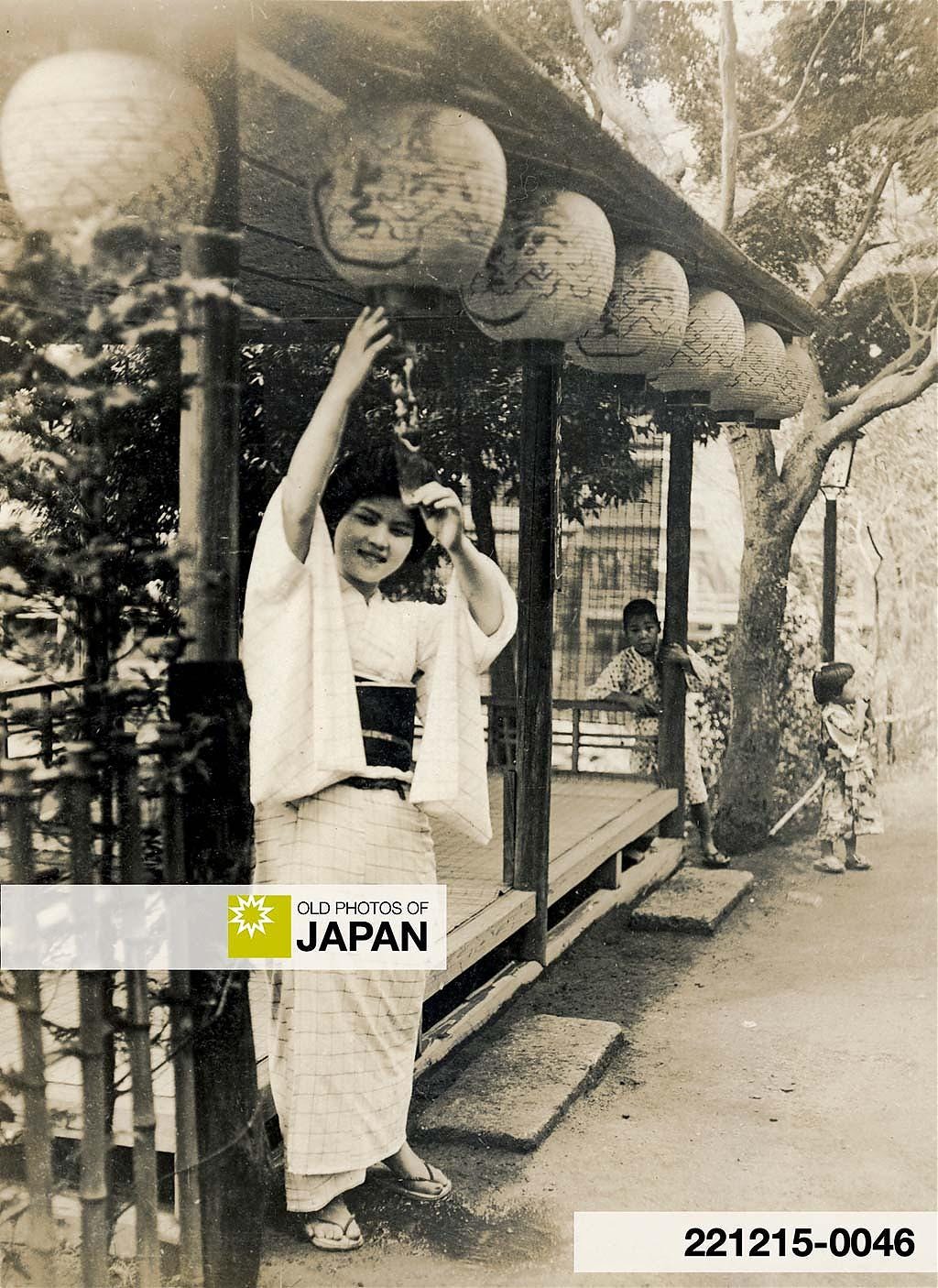 Japanese woman posing in front of a teahouse platform at Jūnisō, ca. 1915–1919