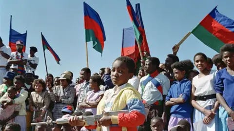 AFP Thousands of South West Africa People's Organisation (SWAPO) supporters sing freedom songs, at a rally to celebrate Swapo's 22nd anniversary of their guerrila war against South Africa's continued occupation of Namibia, on August 28, 1988 in Windhoek.