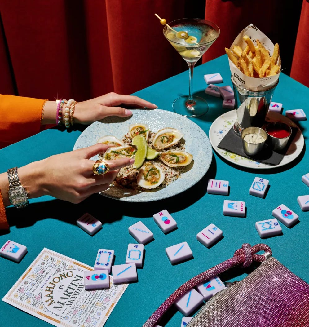 mahjong table with food and a martini