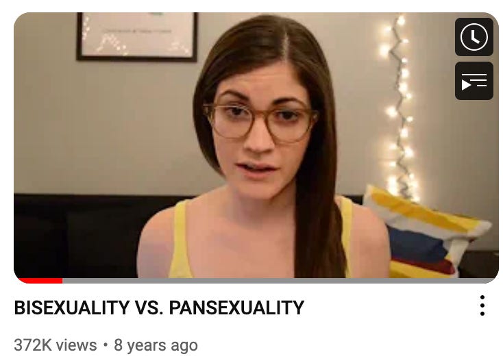 A screenshot of a 20-something Camille in a YouTube video titled BISEXUALITY VS PANSEXUALITY making a serious face at the camera.