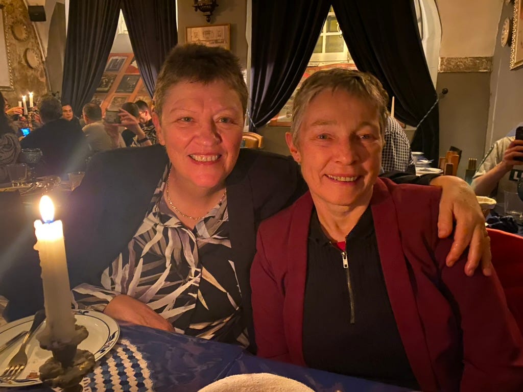 Two smiling geezers at a restaurant in Lisboa