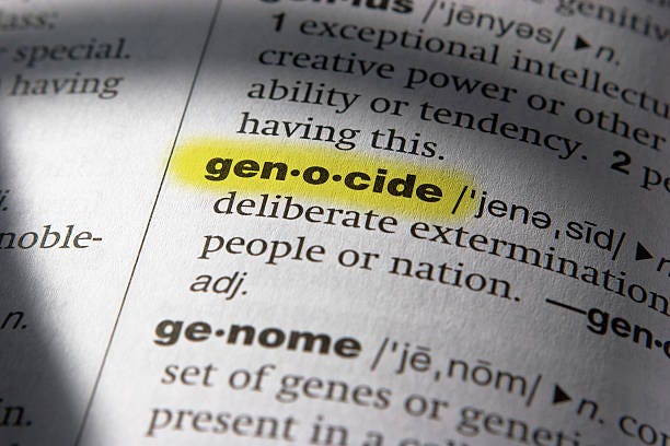 definition of the word genocide (highlighted) - genocide bildbanksfoton och bilder