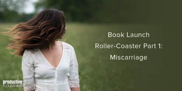 Woman with windswept hair in nature. Text overlay: Book Launch Roller-Coaster Part 1: Miscarriage