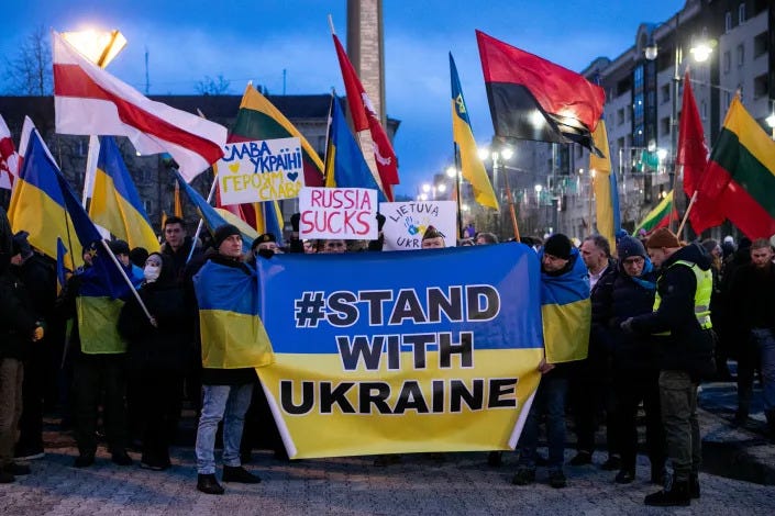  People with flags and posters protest in Vilnius, Lithuania, against the Russian attack on Ukraine in 2022. (Paulius Peleckis/Getty Images)