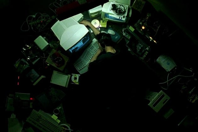 plot explanation - Why does Neo's cubicle not look like the workplace of a  programmer? - Movies & TV Stack Exchange