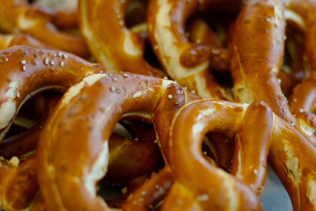 A stack of soft pretzels. "Pretzels" by anaulin is licensed under CC BY-SA 2.0.