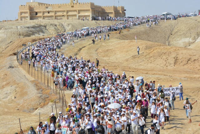 5,000 Israeli and Palestinian women trekked through parts of Israel & the West Bank in 2017, demanding a peace agreement on a 2-week trek organized by Women Wage Peace. It ended w/a rally of approx. 20,000 people outside Netanyahu's residence, demanding a return to peace negotiations. He did not. A stream of hundreds and hundreds of women in mostly white, snaking in a path through the desert