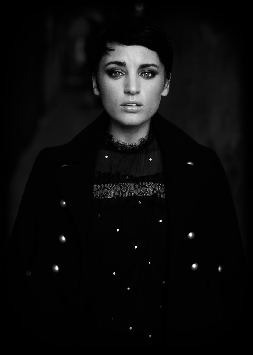 black and white moody portrait with a model with smokey eyes