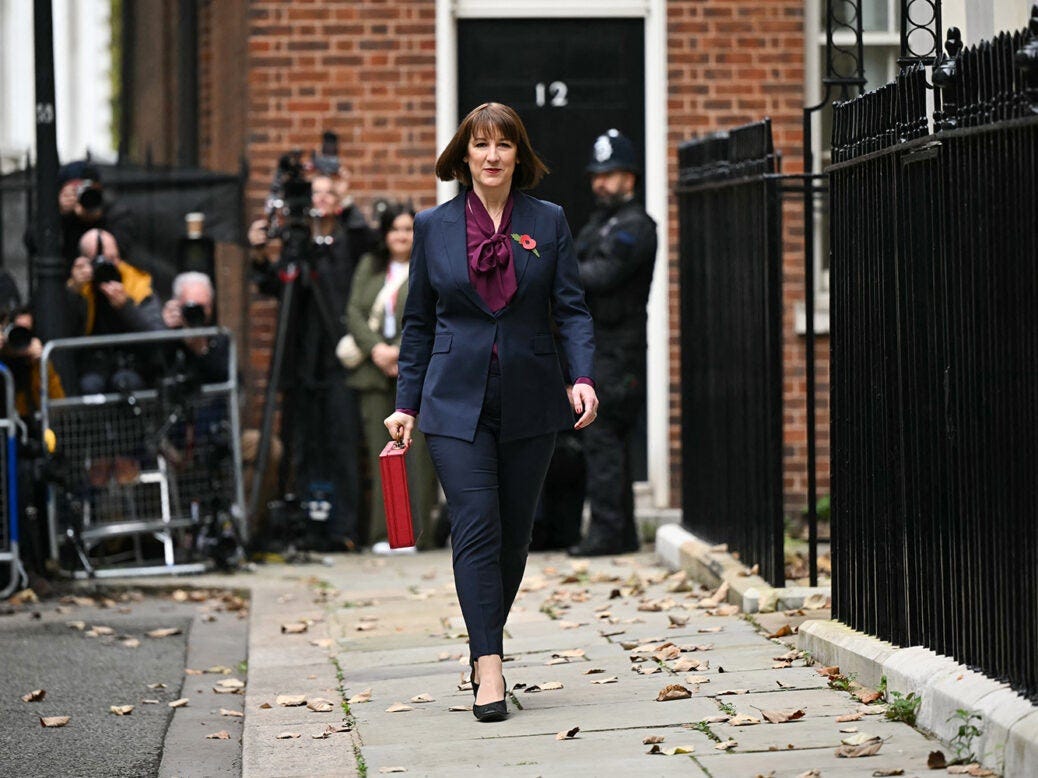 Britain's Chancellor of the Exchequer Rachel Reeves carries the red Budget Box as she leaves 11 Downing Street, in central London.
