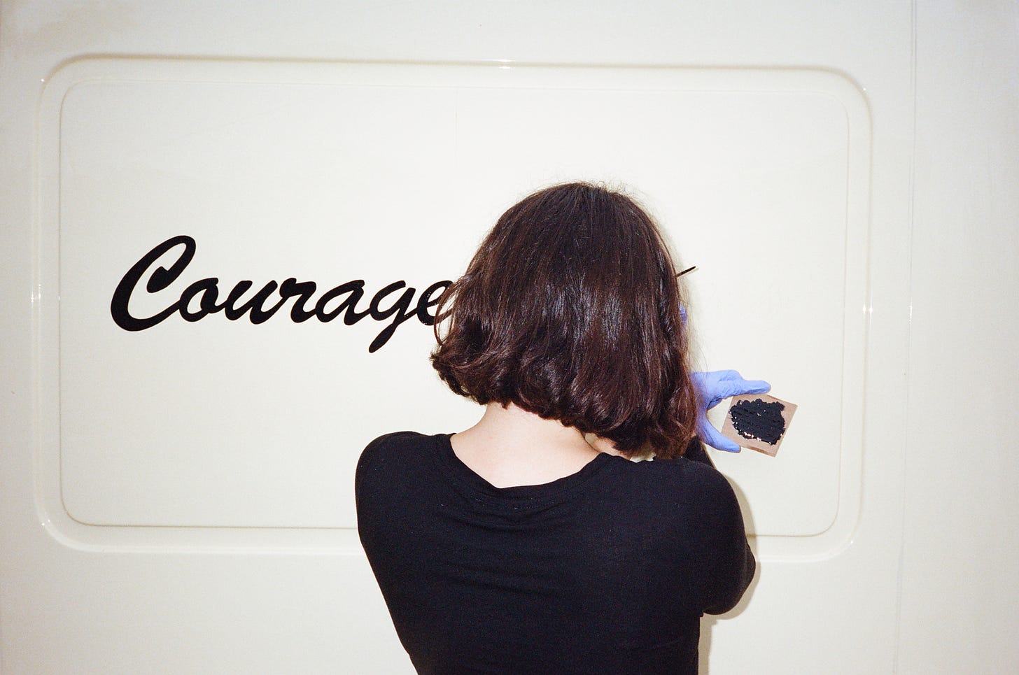 Jenna Homen painting the Courage van