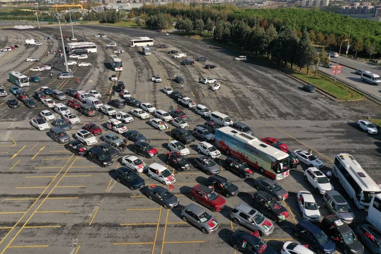 Cars and vans displaying Palestinian and some Turkish flags departed from Istanbul's Ataturk Olympic Stadium on Friday morning. [REUTERS/Murad Sezer]