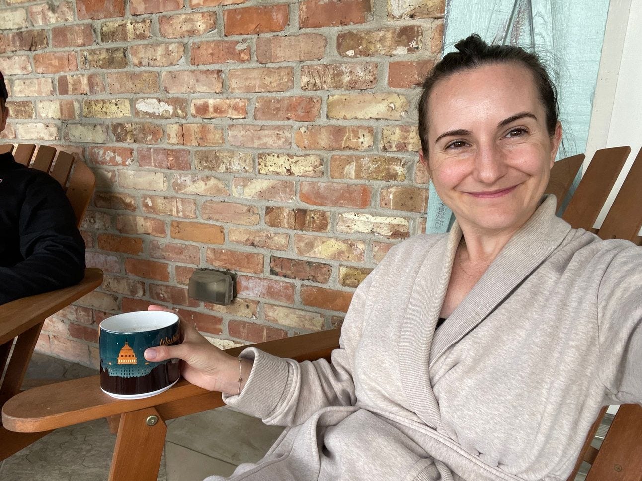Mom sitting in a front porch chair drinking coffee Mom sitting in a front porch chair drinking coffee