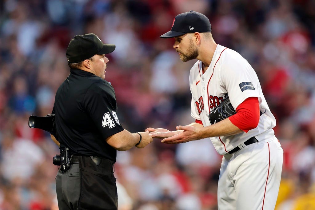 Umpire Nick Mahrley checks Boston Red Sox's James Paxton for foreign substances during the second inning of a baseball game against the St. Louis Cardinals, Friday, May 12, 2023, in Boston.