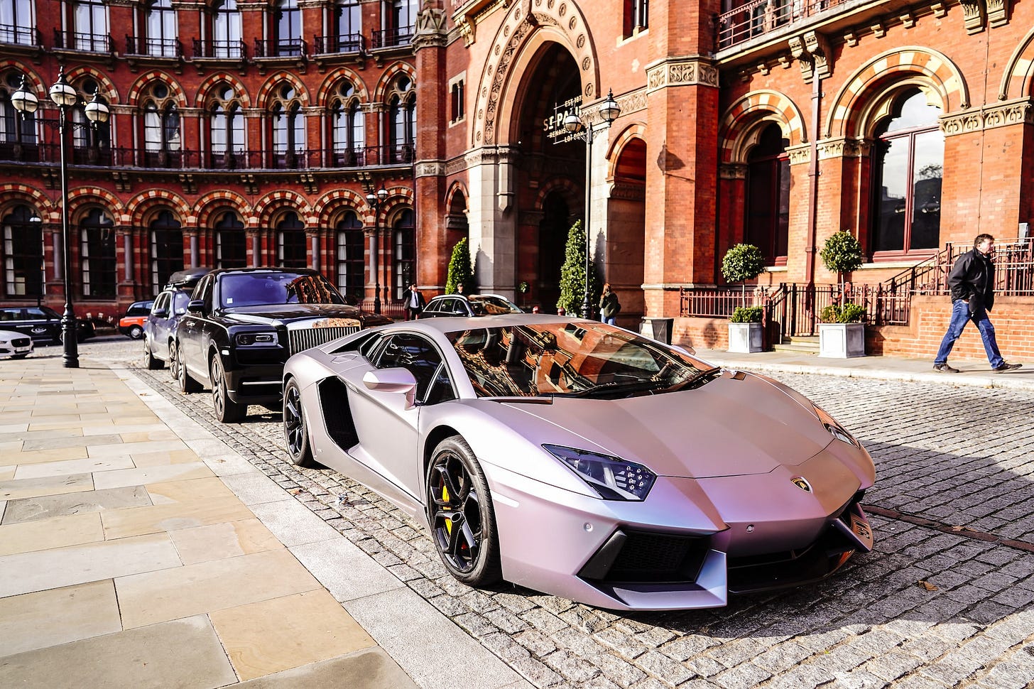 Lamborghini and Rolls Royce near the Renaissance hotel