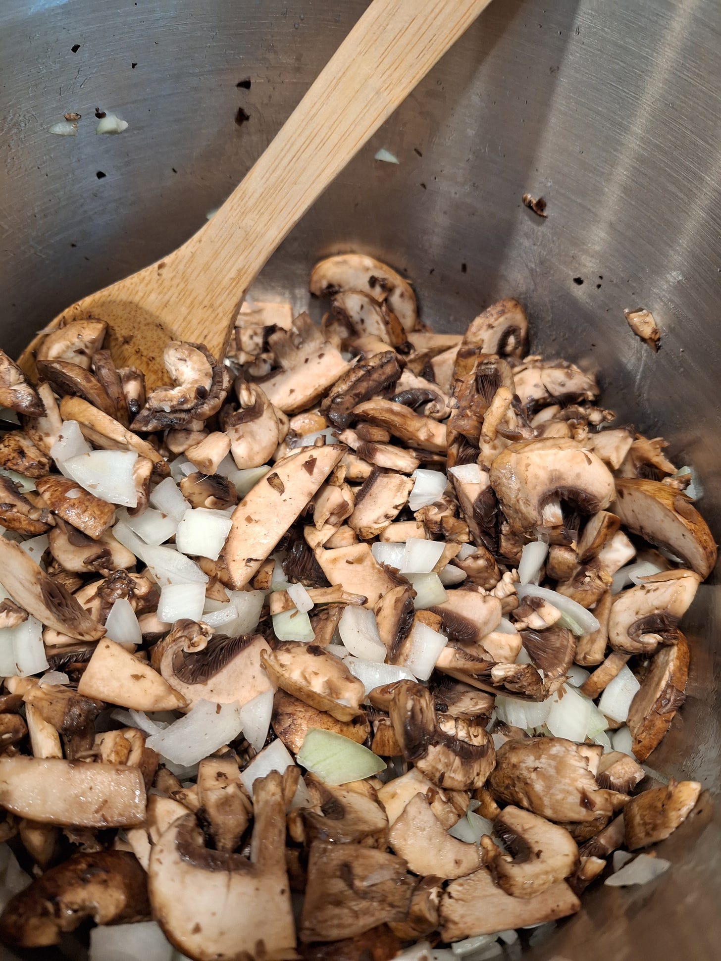 mushroom and onions being cooked for the beginning of the soup