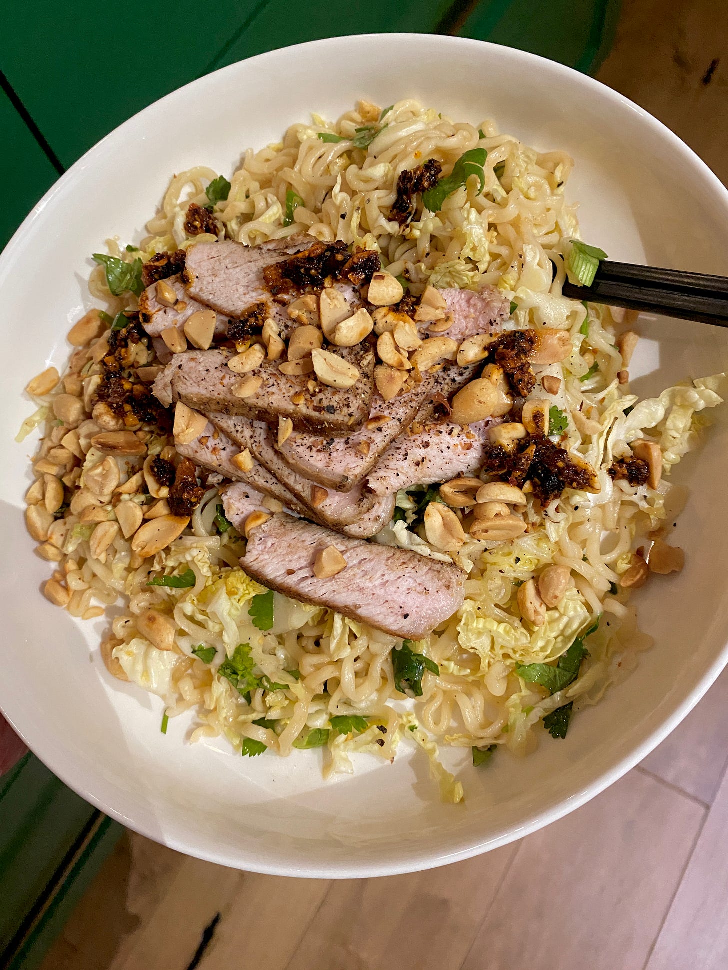 ramen noodles with pork and peanuts on top