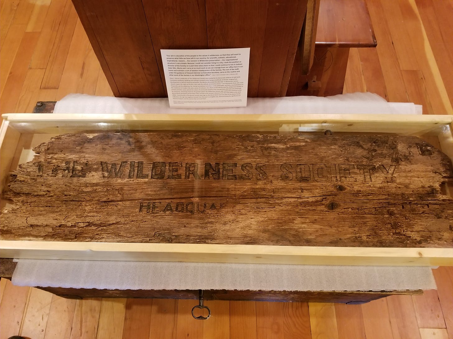 board with the wilderness society headquarters carved into it