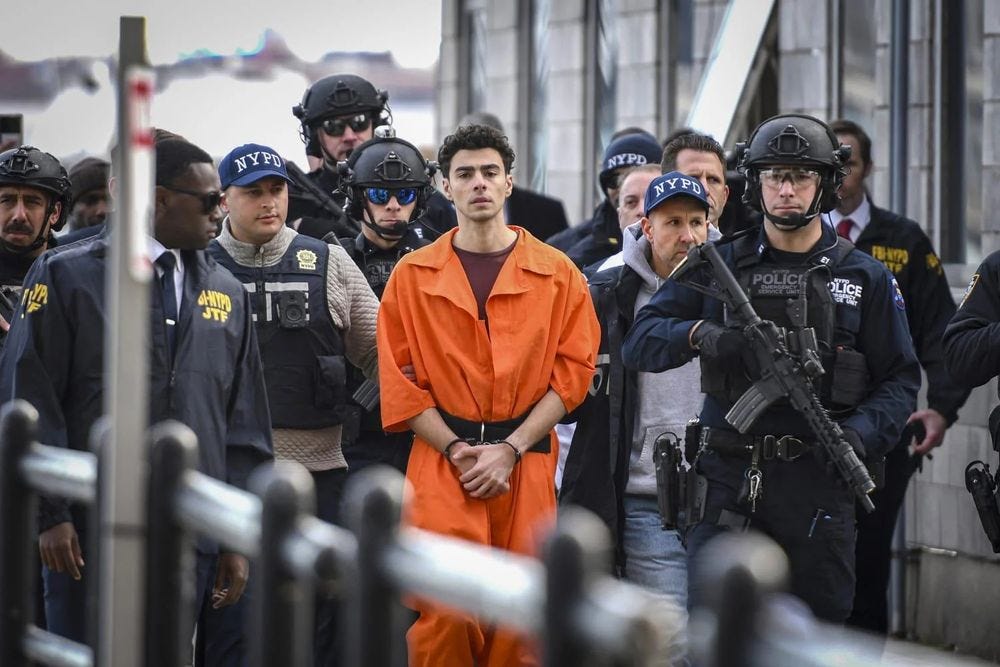 Luigi Mangione is surrounded by a lot of police 