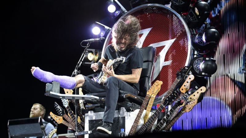 Injured Dave Grohl performs on a throne | CNN