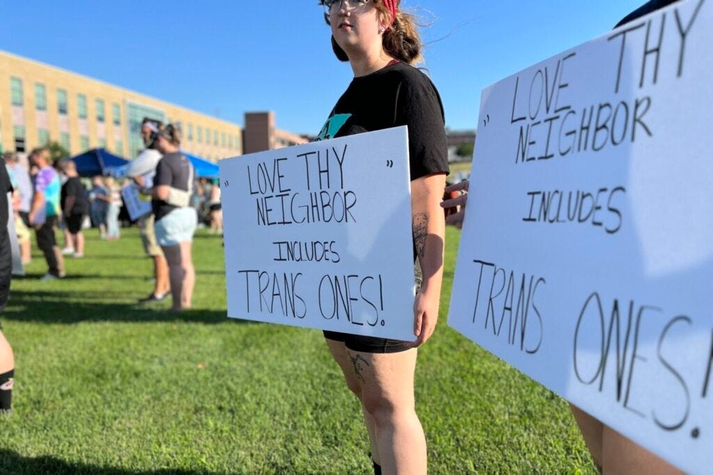 Opponents of the state's ban on gender-affirming health care for transgender children gather at Van Eps Park in downtown Sioux Falls on July 28, 2023. The protesters called for state lawmakers to repeal the ban. (Joshua Haiar/South Dakota Searchlight)