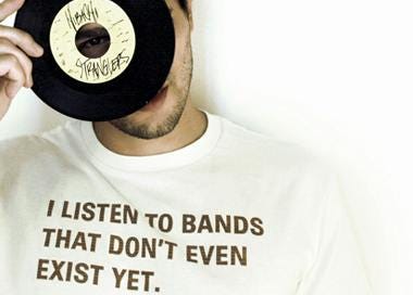 Image of person wearing a t-shirt that reads "I listen to bands that don't even exist yet."