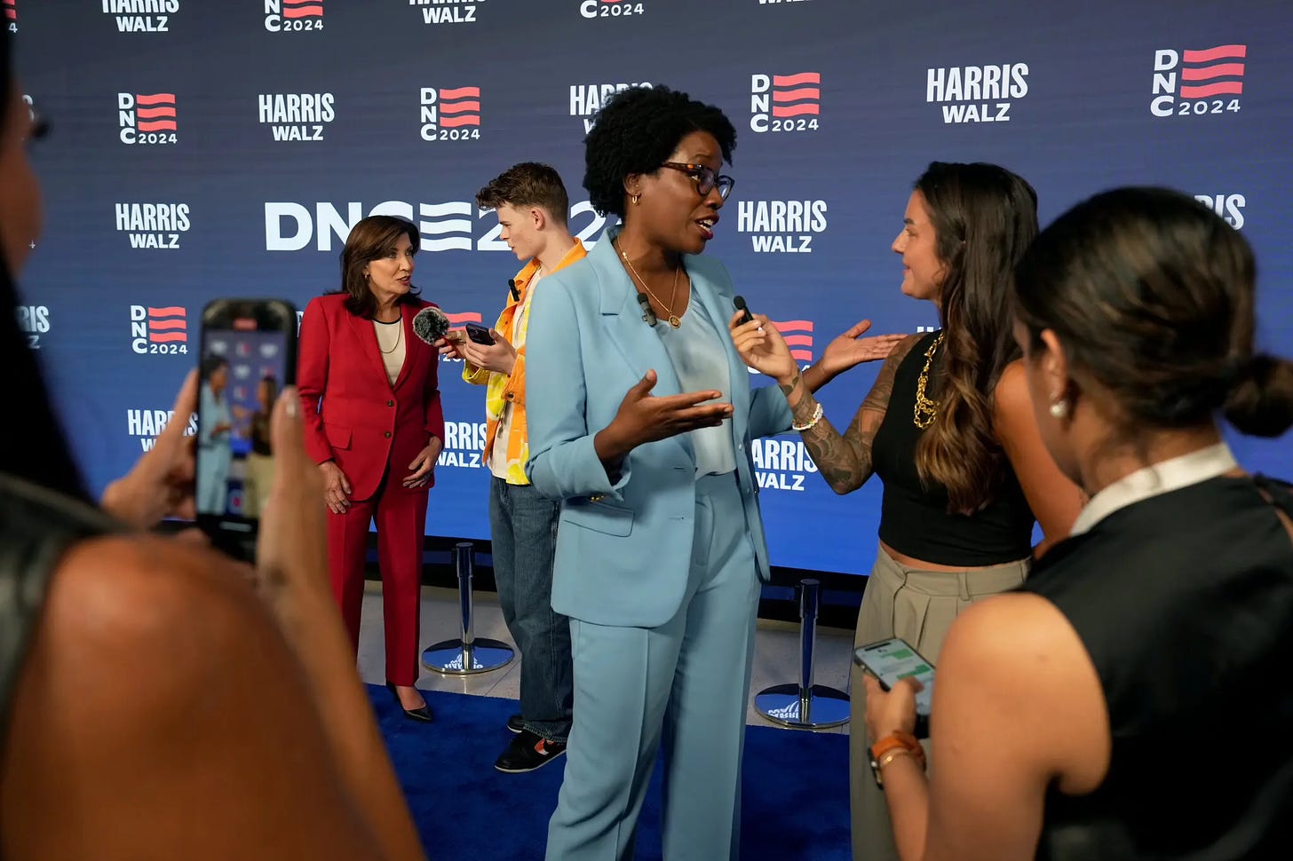 Influencers interviewed Gov. Kathy Hochul of New York, left, Representative Lauren Underwood of Illinois, center, and other politicians on what DNC planners called the convention’s “blue carpet.”