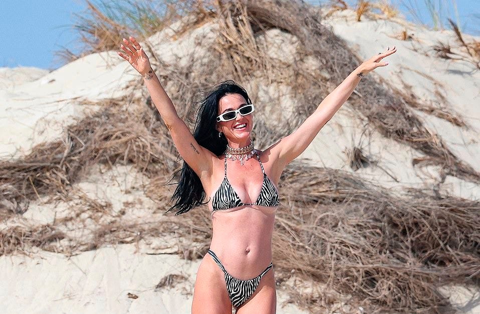 The pop superstar, who is said to be engrossed in 'crisis talks' following the failure of her comeback single Woman's World, flaunted her gorgeous curves in the swimwear