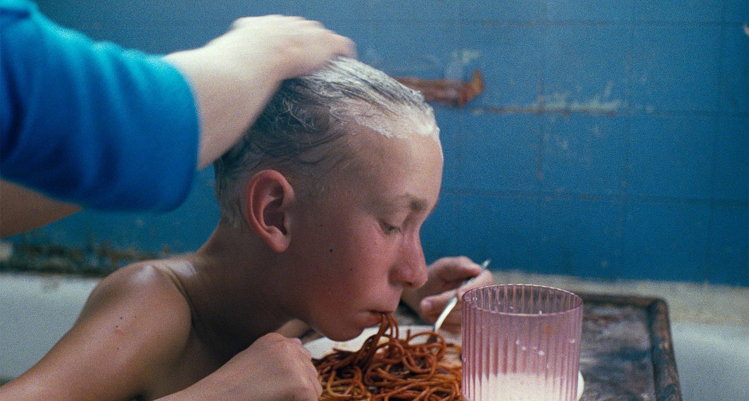 Gummo | Still features Jacob Reynolds as Solomon bathing while eating spaghetti.