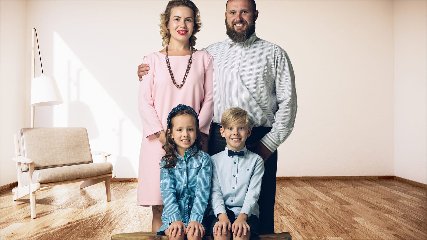 traditional family, husband wife, 2 kids — girl and boy — standing in a living room