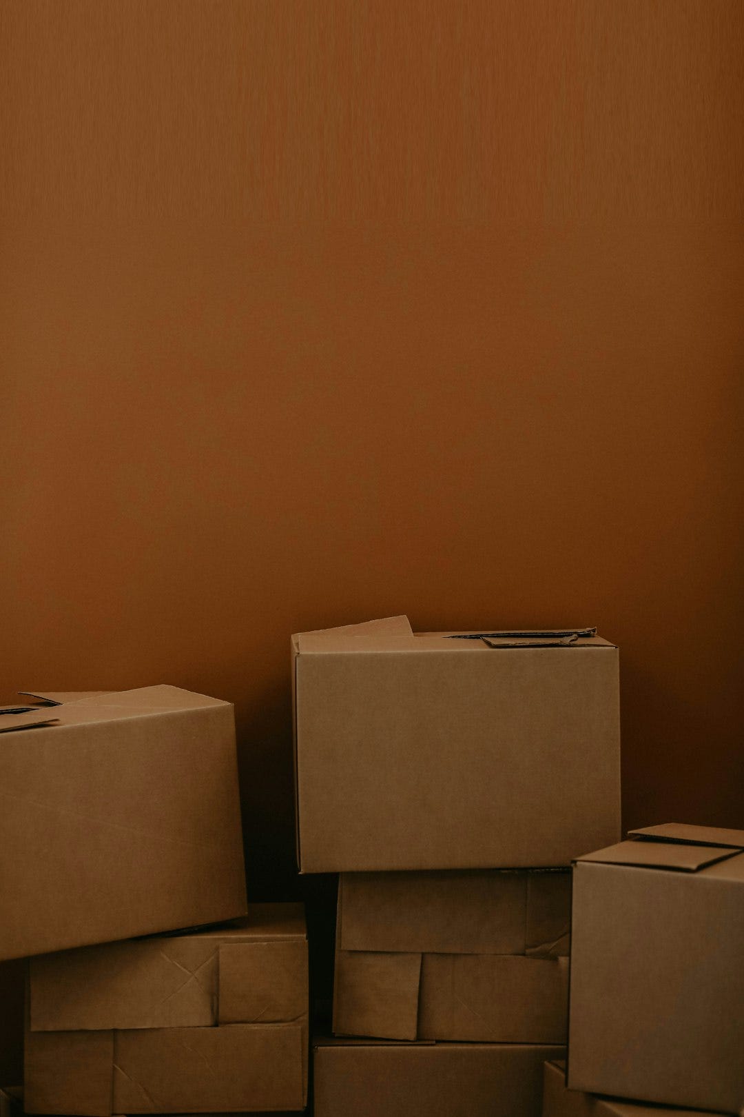 white cardboard box on brown wooden table white cardboard box on brown wooden table