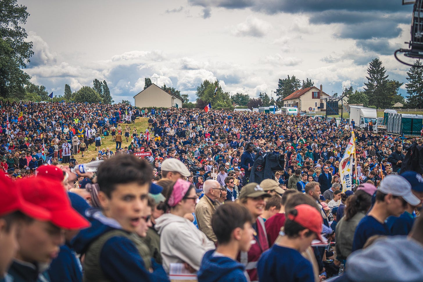May be an image of 1 person, crowd and text