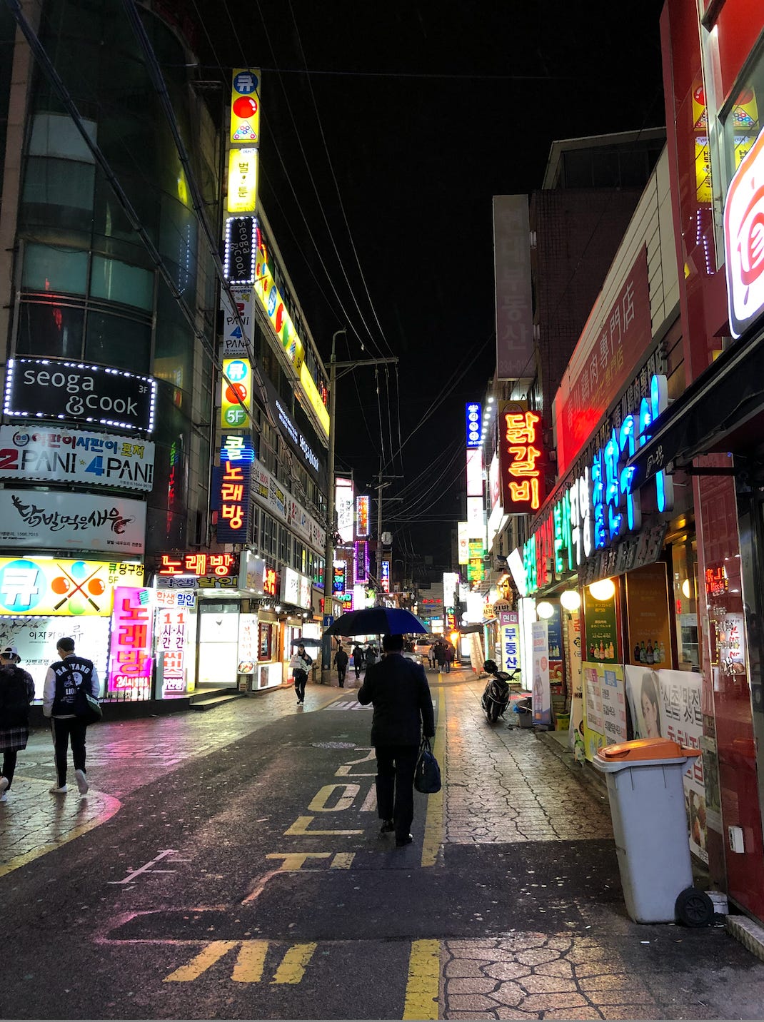 A photo of a neon-lit alley in Sinchon.