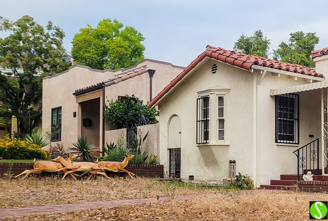Reindeer leaning on wall of house in LA