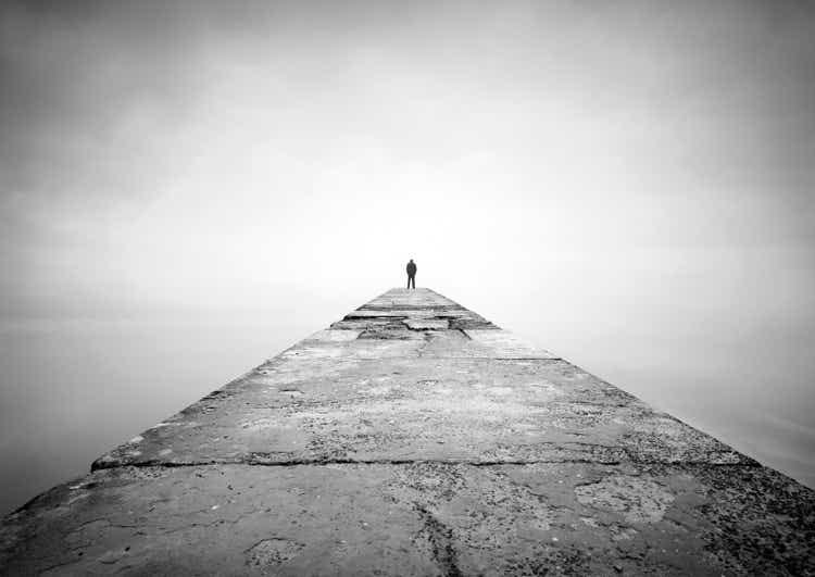 Man on the edge of pier