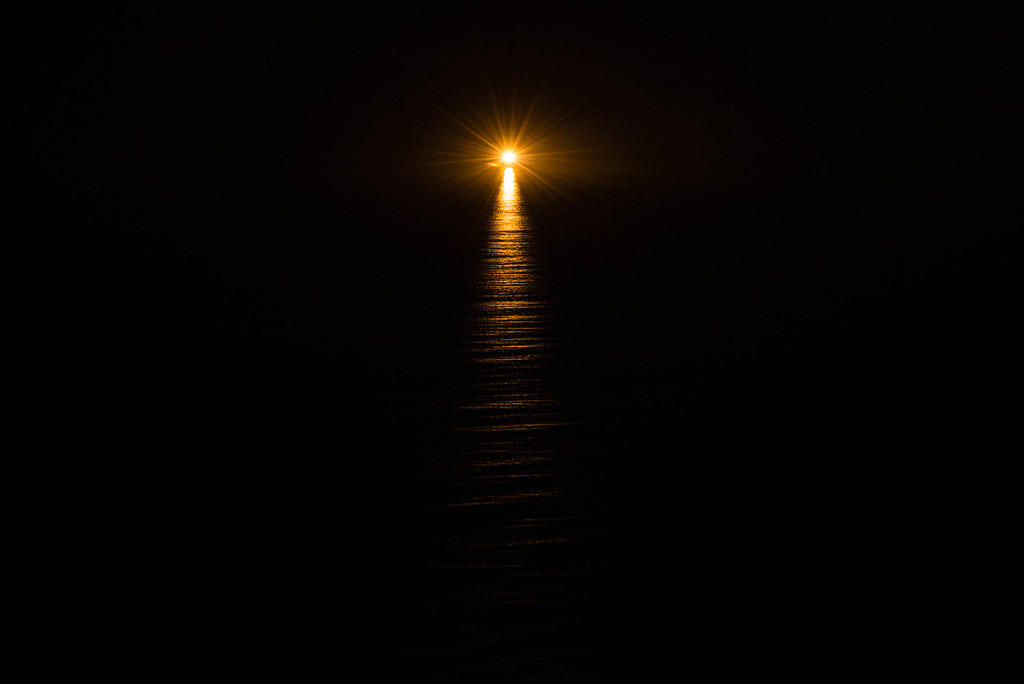 The sun sets on the sea 