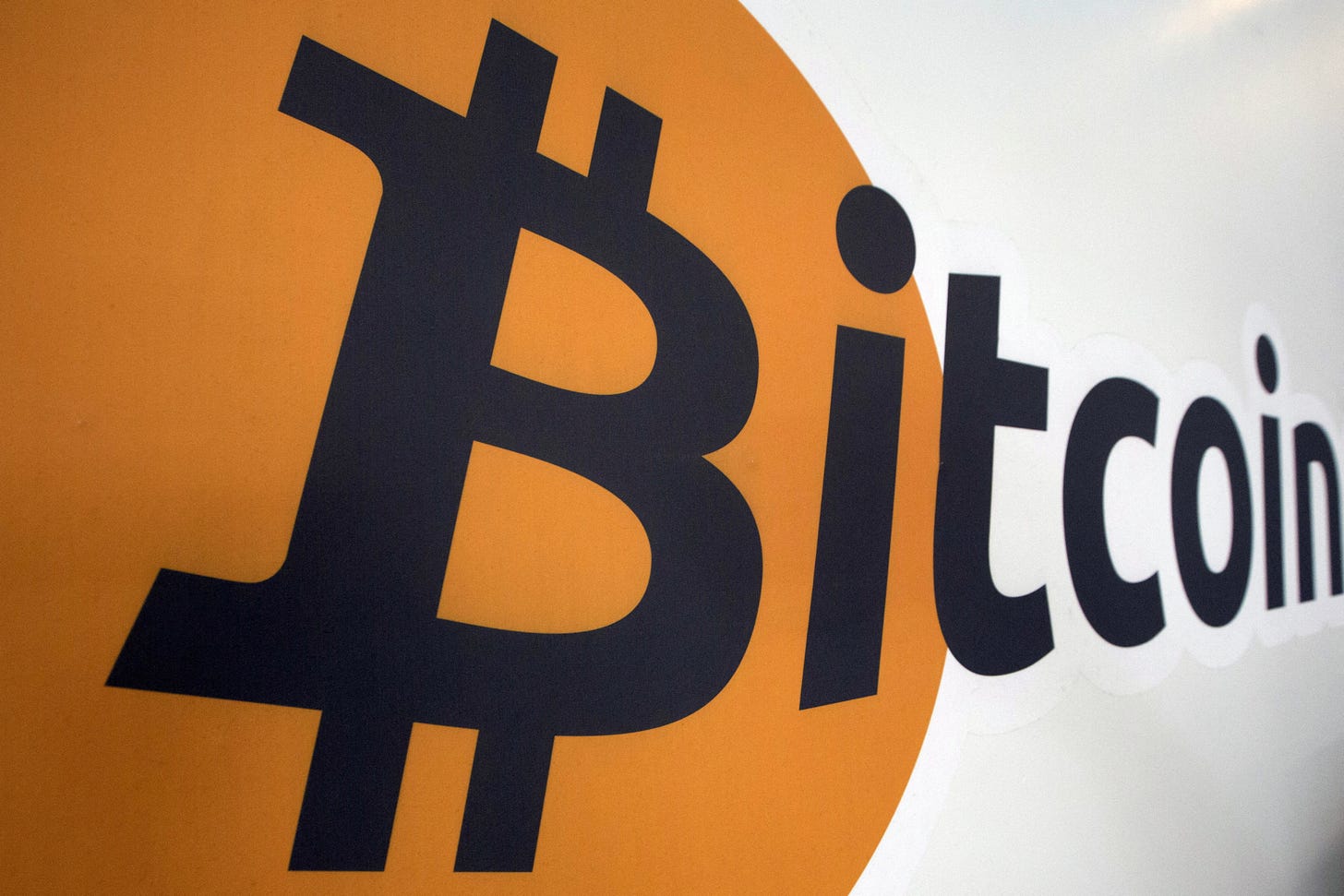 A Bitcoin logo is displayed at the Bitcoin Center New York City in New York's financial district