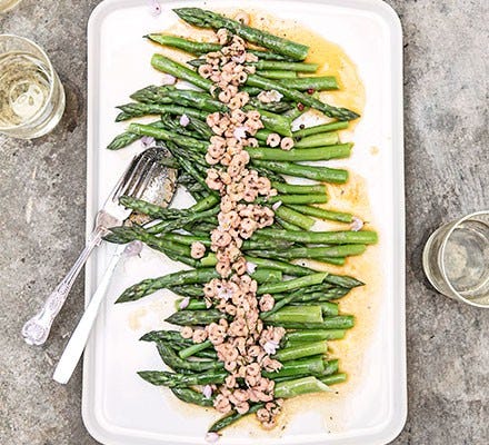 Asparagus with spiced butter & brown shrimp served on a rectangular dish